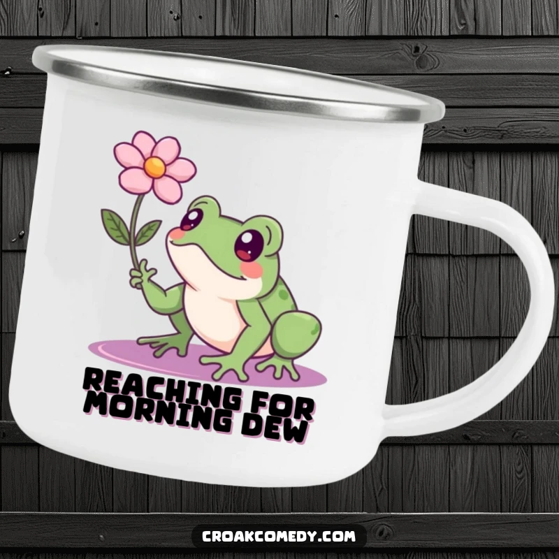 Funny frog with a determined expression reaching for a floating flower, an enamel camping mug for persistent explorers.