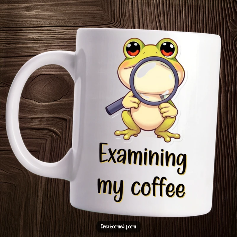 Funny Frog Mug: A curious cartoon frog peering intently through a magnifying glass, seeking details humorously.