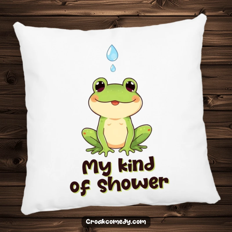 Funny pillow featuring a smiling frog positioned to catch a falling raindrop, offering comfort and a touch of playful charm.