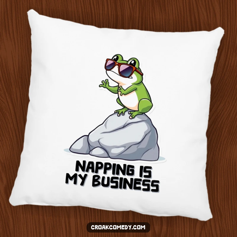 Funny frog wearing sunglasses, balancing on a rock, creating a cool and humorous design for this comfortable pillow.