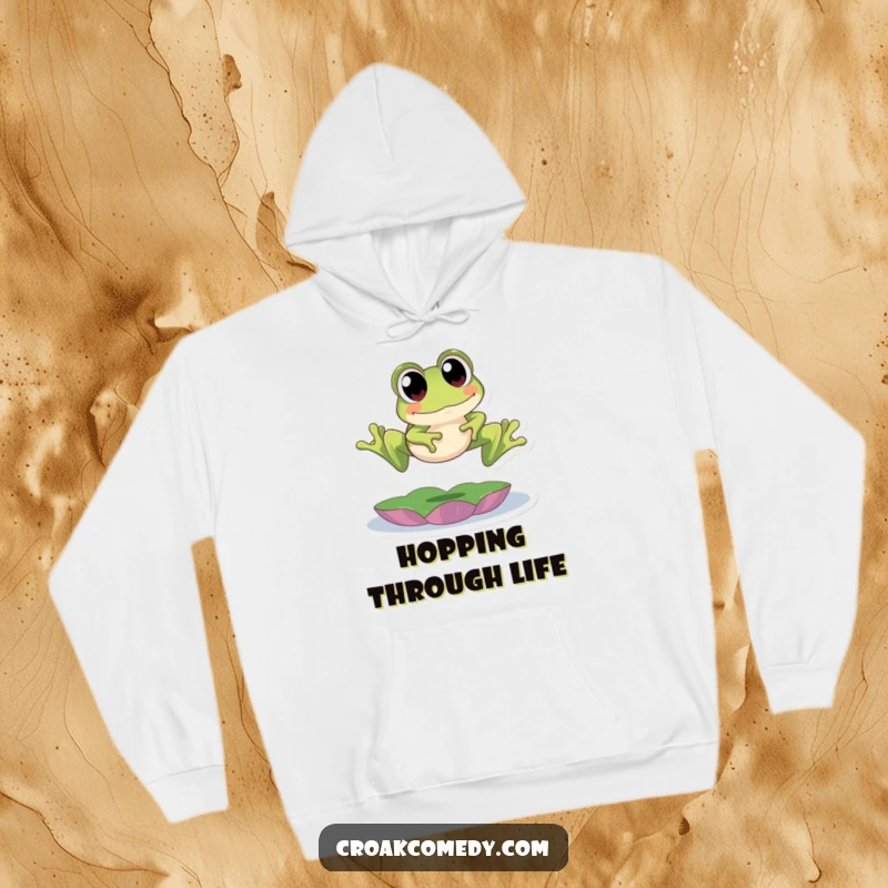 Funny Hoodie: A cute frog with big eyes energetically leaping over a lily pad, offering warmth and a dose of amphibious humor.