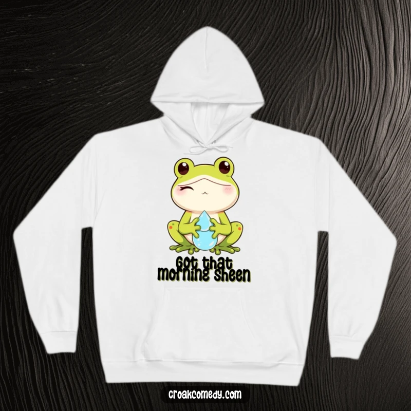 Funny hoodie depicting a winking frog holding a dewdrop, offering warmth and a dose of lighthearted fun.