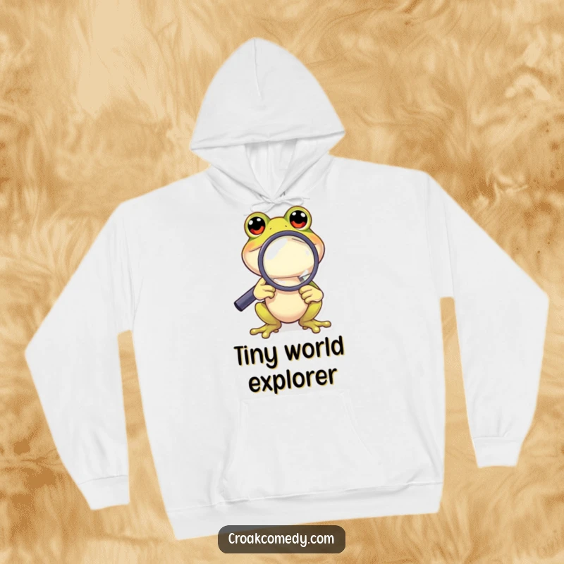 Funny Frog Hoodie: A curious cartoon frog holding a magnifying glass, examining the world with humorous intensity.