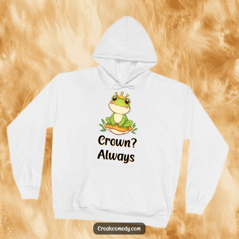 Funny frog wearing a crown sits regally on a mushroom, offering warm, humorous style in this hoodie.