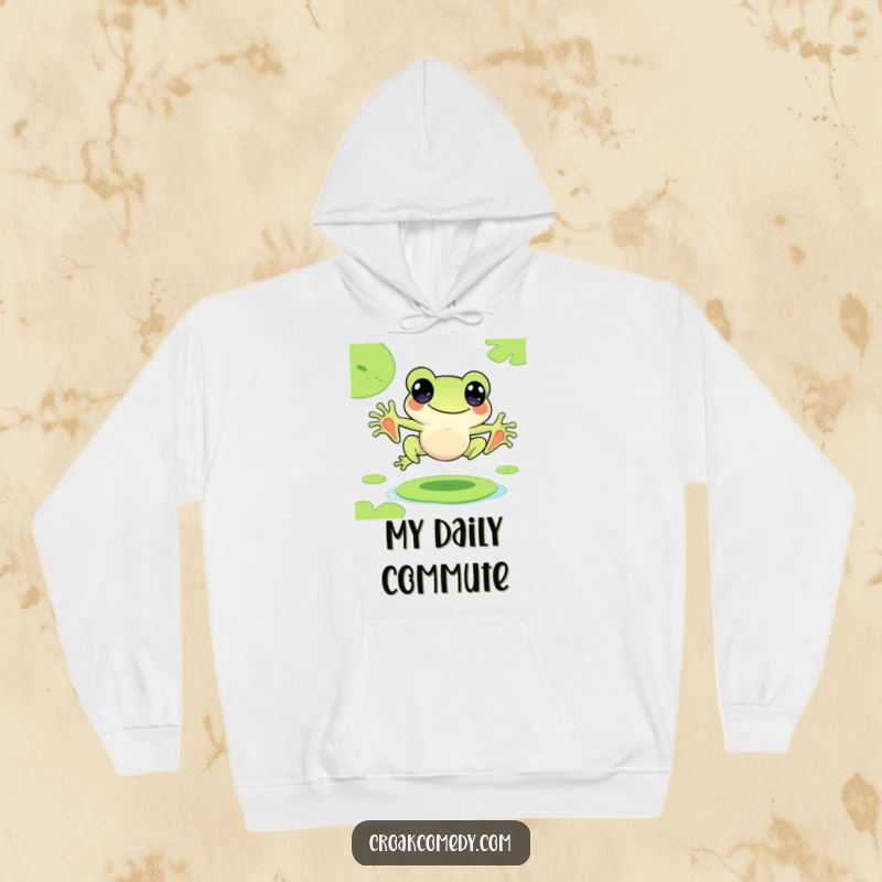Funny hoodie depicting a cute frog character joyfully leaping from one lily pad to another, embodying happiness.