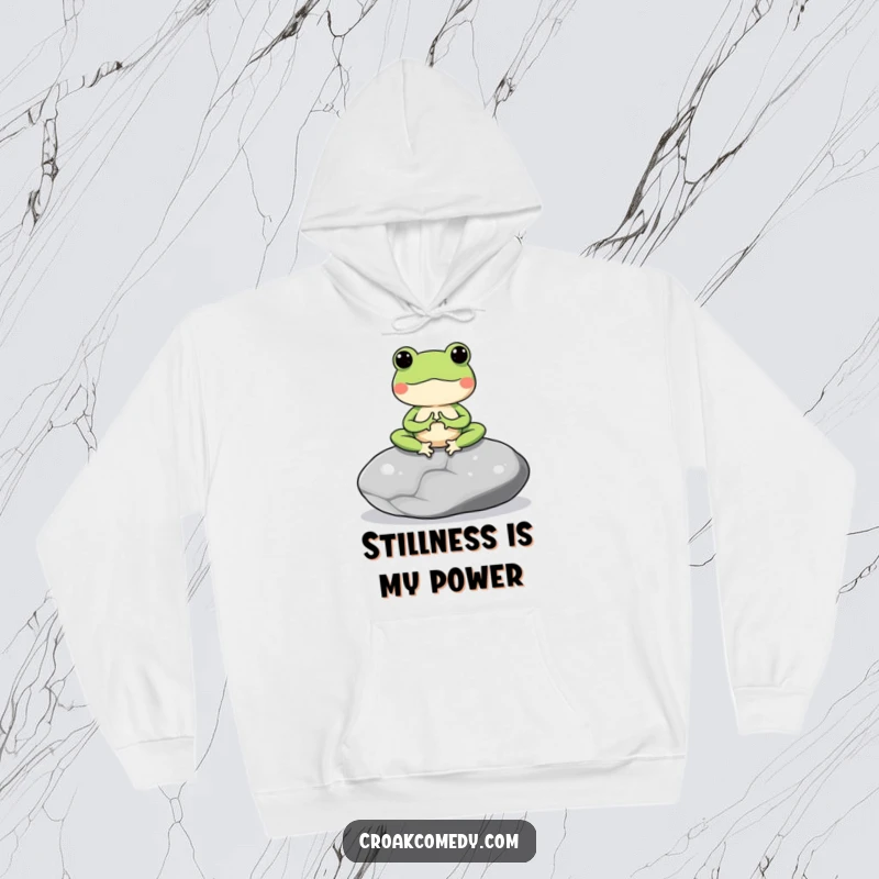 Funny hoodie depicting a meditating frog on a stone, offering warmth and a peaceful, comforting vibe.