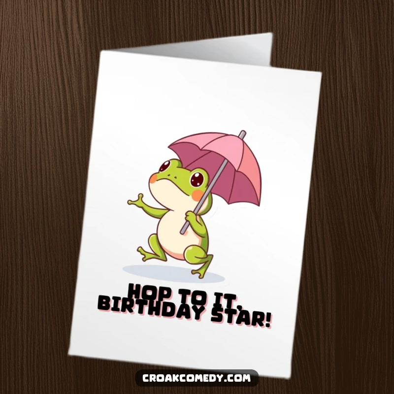 Funny Free Printable Birthday Card featuring a cheerful frog hopping under a tiny umbrella, ready for a celebration.