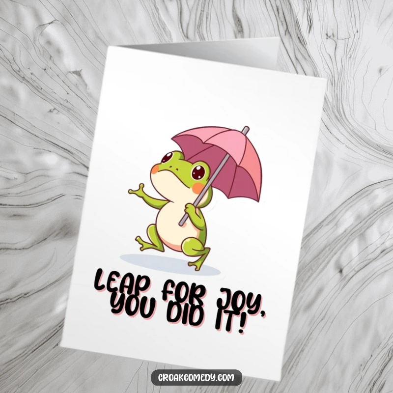 Funny Free Printable Congratulations Card showing a happy frog mid-hop with a small umbrella, celebrating a major achievement.