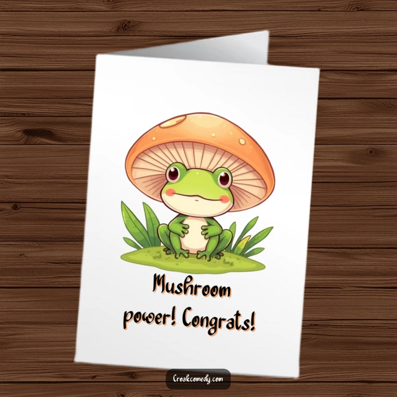 Funny free printable congratulations card: a happy frog peeking curiously from behind a large mushroom, sharing good news.