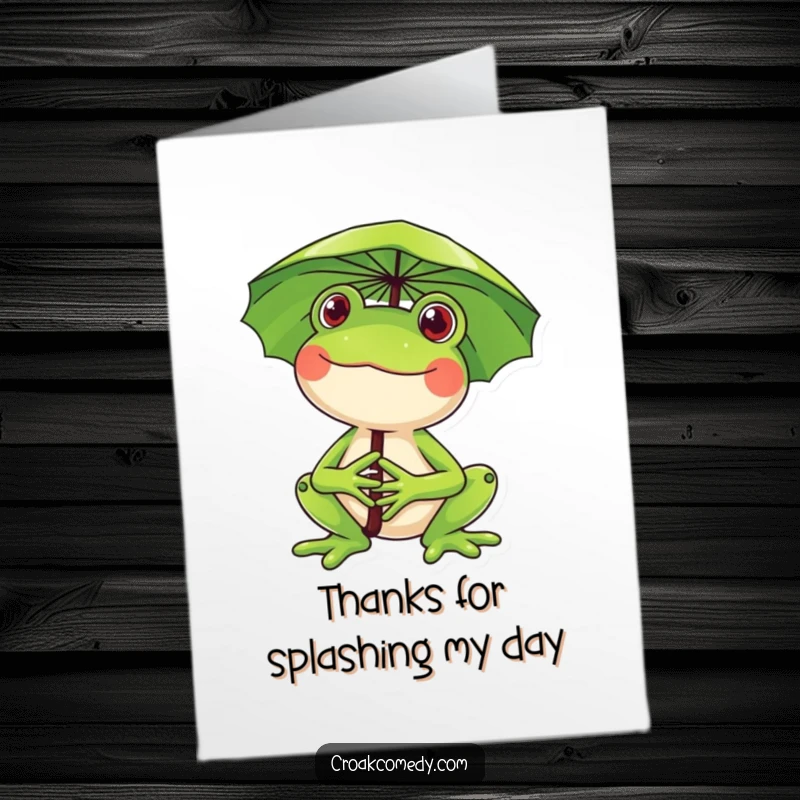 Funny Free Printable Thank You Card: A happy frog with a big smile holds a lily pad umbrella, conveying thanks.