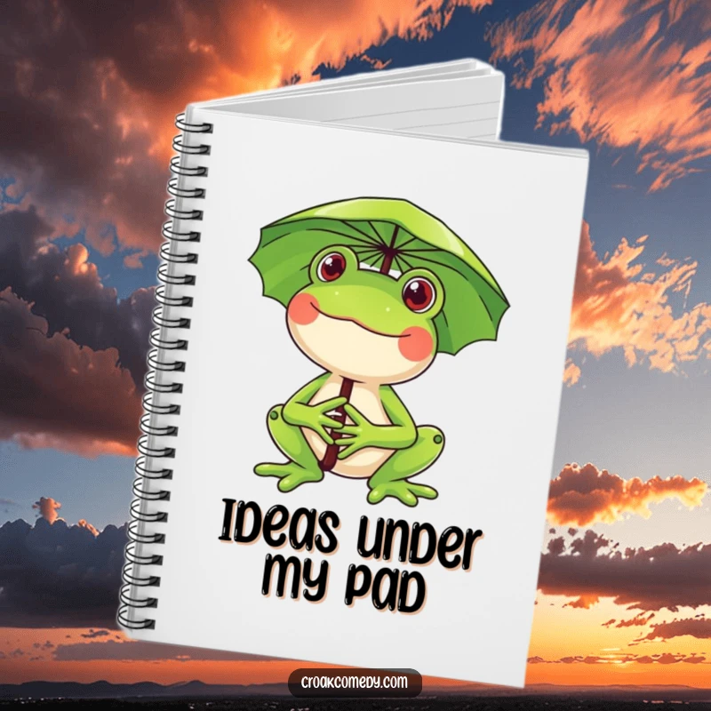 Funny frog notebook, a happy frog holding a lily pad umbrella, smiling, perfect for notes, drawings, and sparking creative joy.
