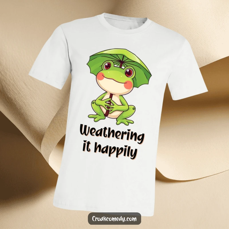 Funny frog t-shirt, a happy frog holding a lily pad over its head as an umbrella, smiling brightly, perfect for rainy days.