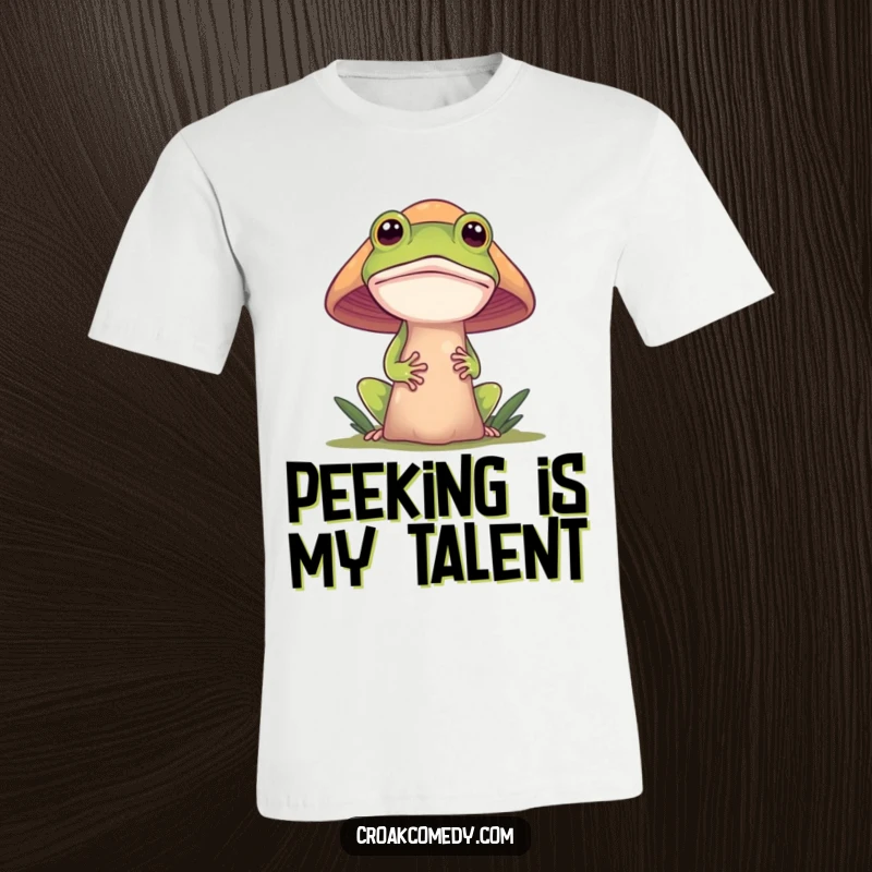 Funny frog t-shirt, a curious frog peeking out from behind a large, colorful mushroom, conveying a sense of playful secrecy.