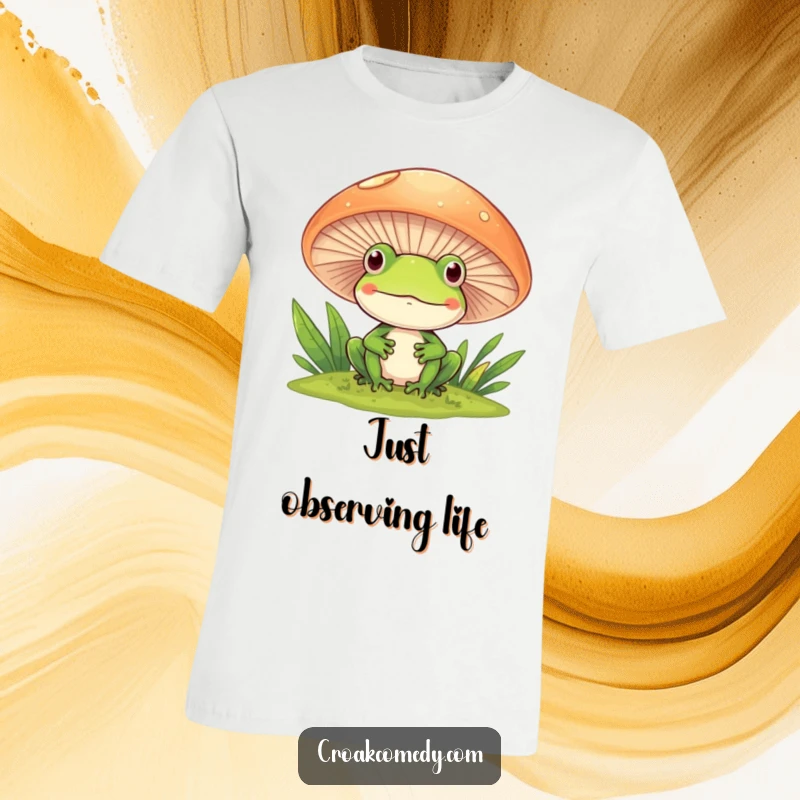 Funny Frog T-Shirt peeking playfully from behind a large mushroom, smiling with curiosity.