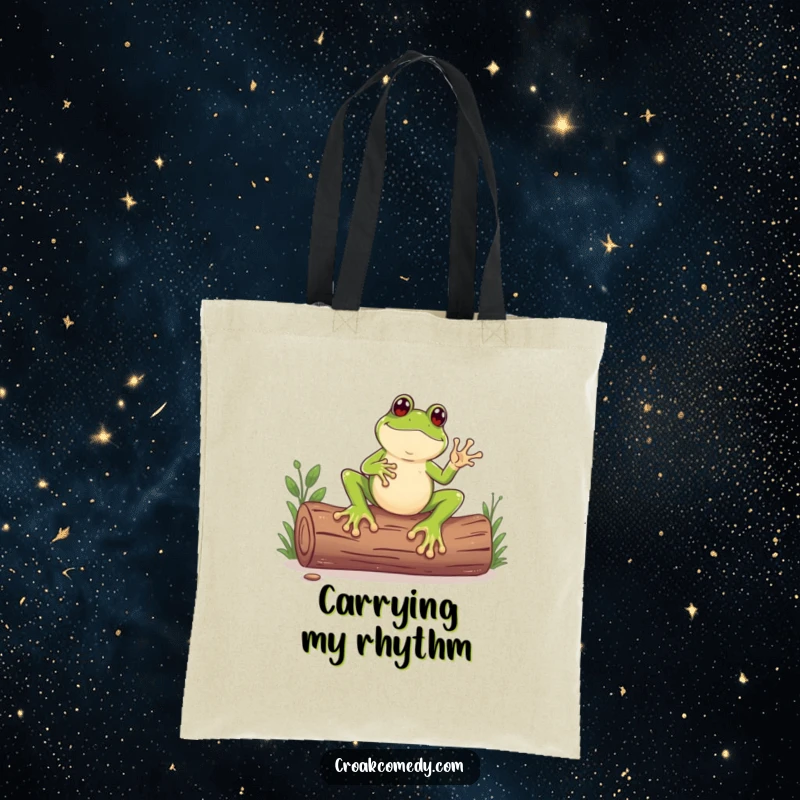 Funny tote bag showing a frog with unusually large feet tapping a log like a drum, great for carrying essentials.