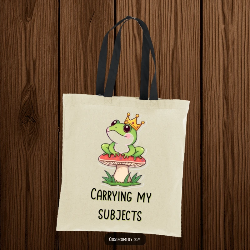 Funny Tote Bag: Frog with crown sits regally on a mushroom, perfect for carrying royal decrees.
