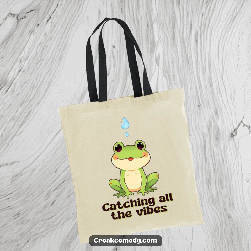 Funny tote bag featuring a cheerful frog expertly catching a falling raindrop, showcasing a unique and delightful artistic style.