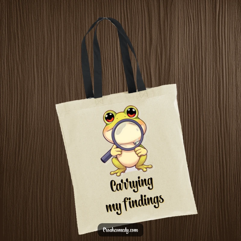 Funny Frog Tote Bag: A curious frog character peering through a magnifying glass, a humorous and functional carry-all.