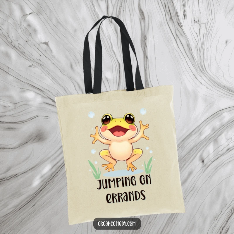 Funny Frog Tote Bag showing an excited frog jumping between dewdrops with glee, perfect for carrying fun.
